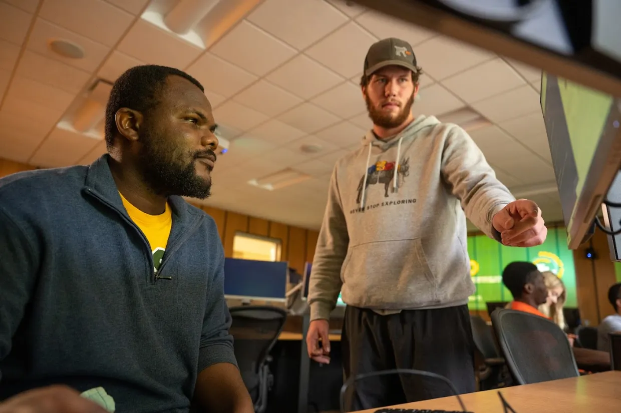 NDSU master's students in the Commodity Trading Lab at Richard H. Barry Hall