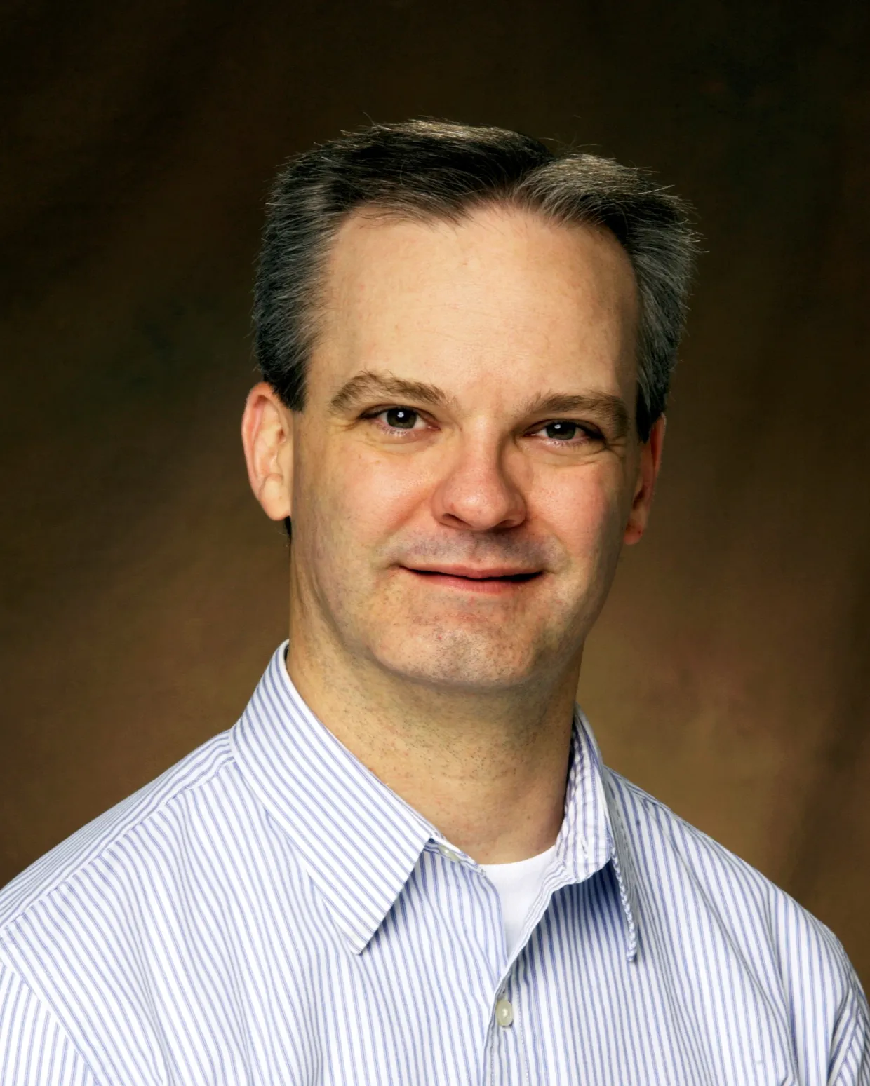 John Wilkinson smiling confidently at the camera