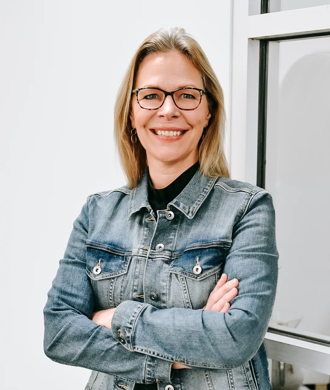 Kim smiling at the camera.