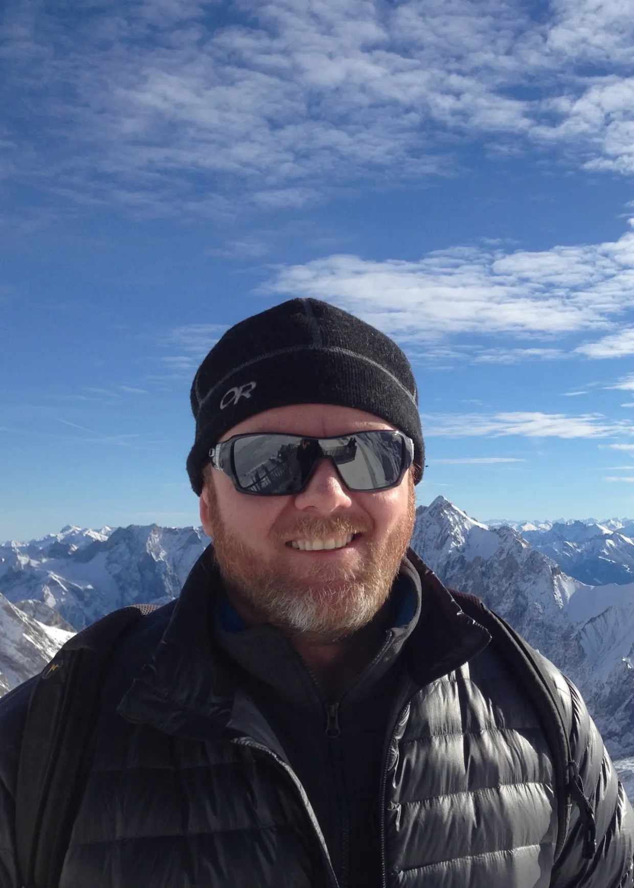 Ned smiling confidently at camera.