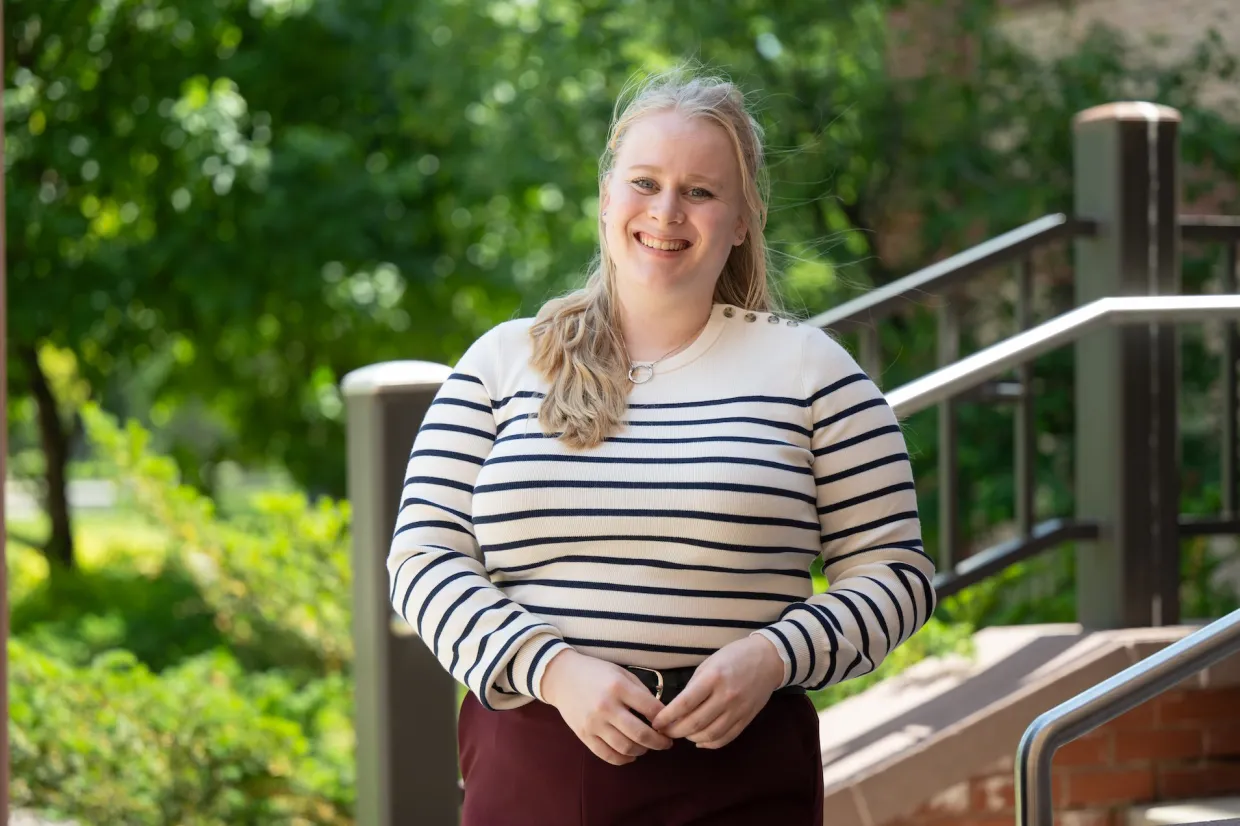 Olivia Svanes smiling confidently at camera. 