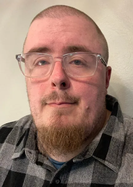 Adam looking confidently at the camera.