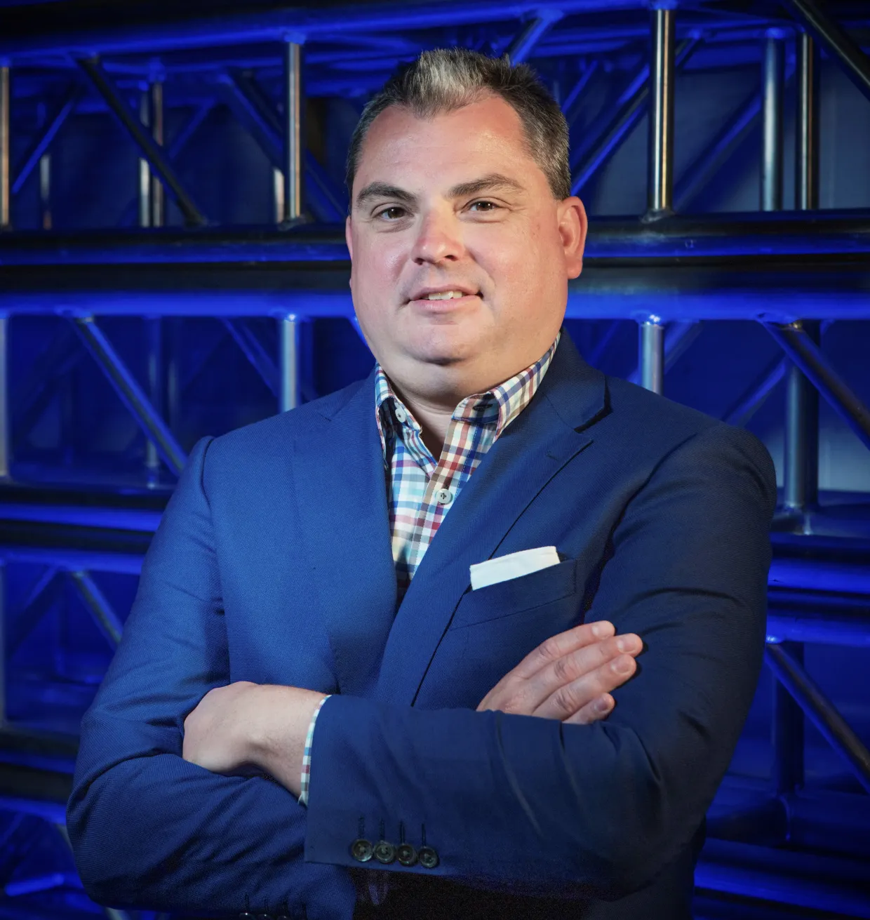 Rick Gion smiling confidently at camera.