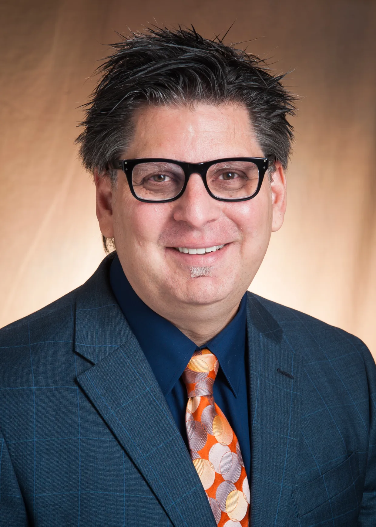 David Bertolini smiling confidently at camera.