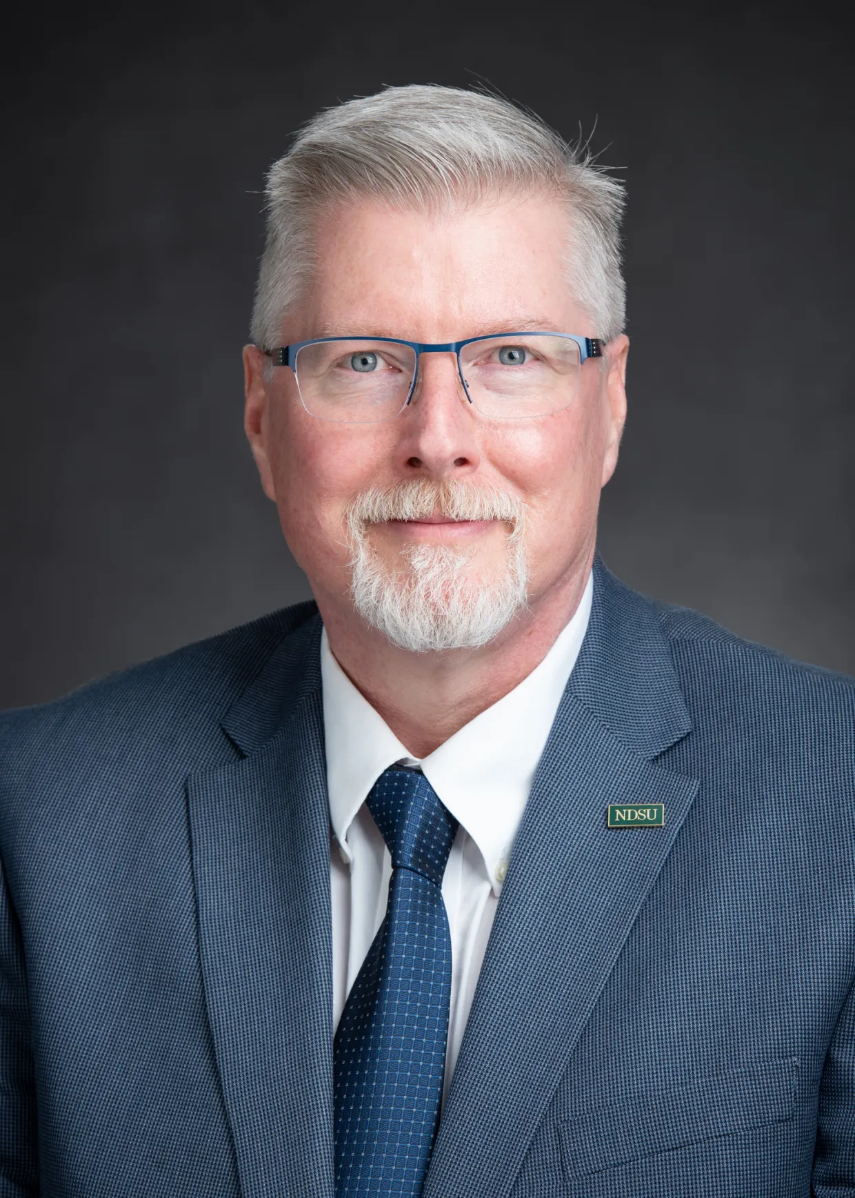 Cooley smiling confidently at camera