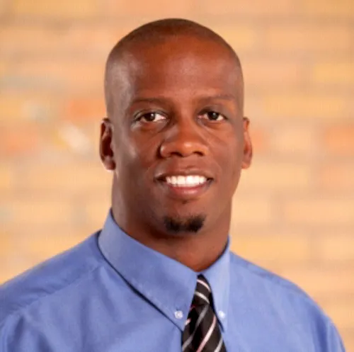 Melvin Whitney smiling confidently at camera.