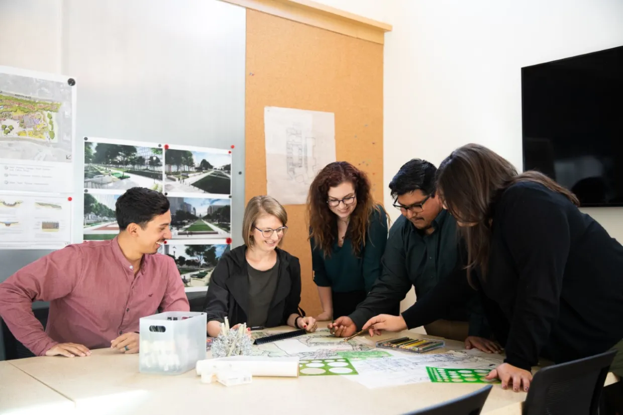 Carlos Montoya working with colleagues.