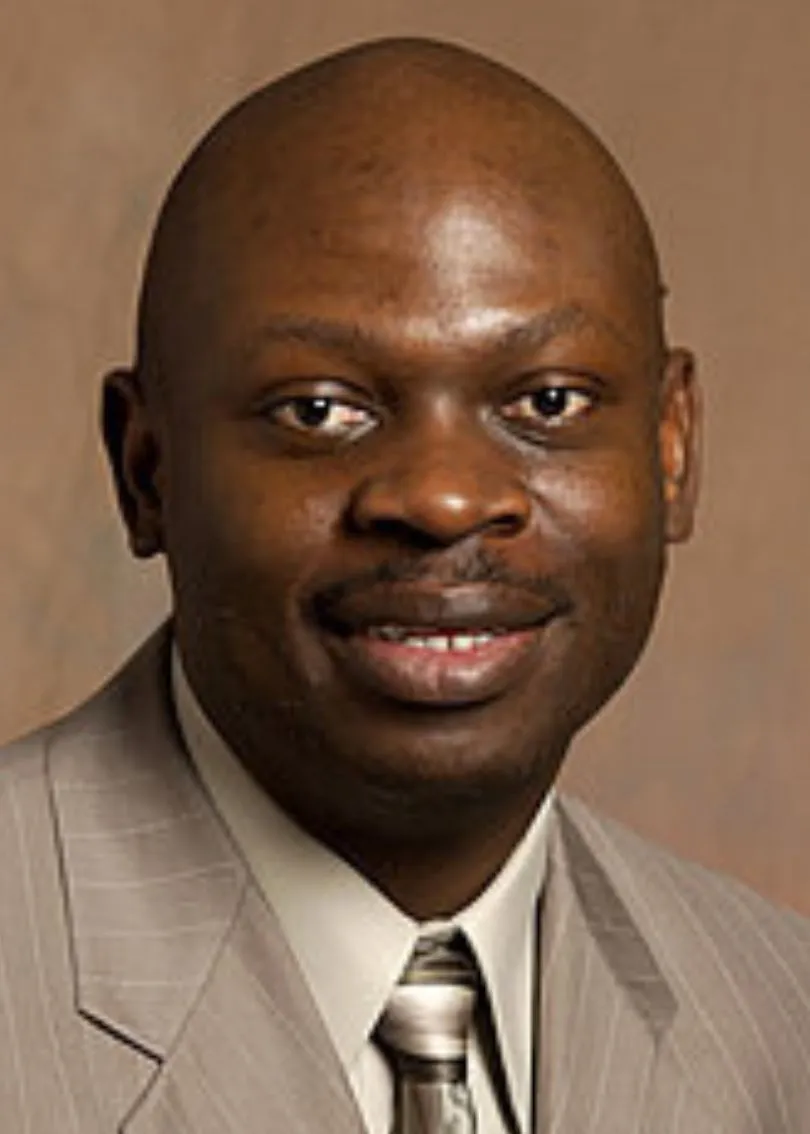 Peter Oduor smiling confidently at the camera