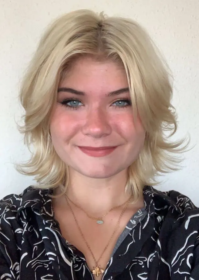 Morgan Chandler smiling confidently at camera.