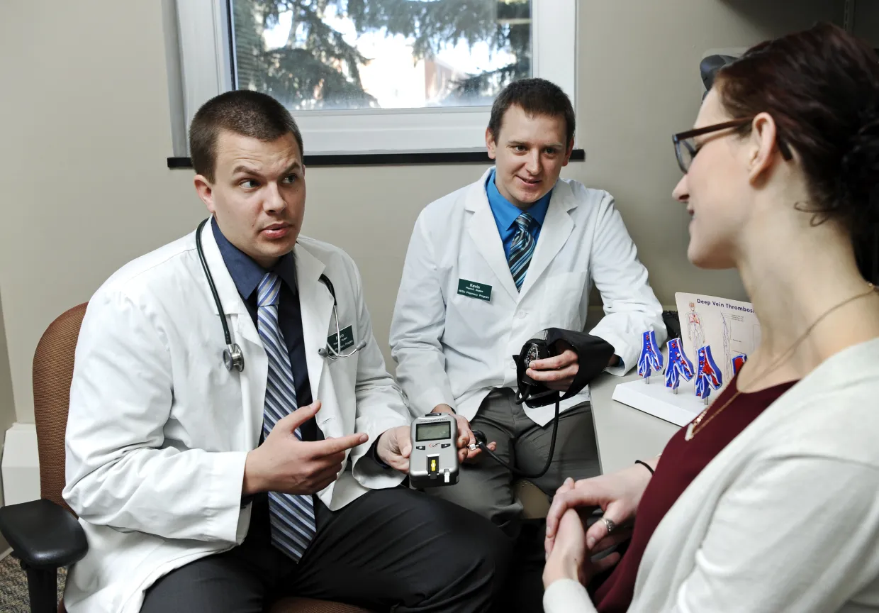 Image of students with patient