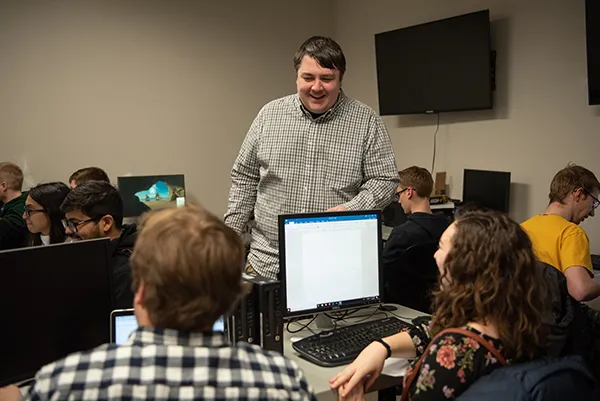 Professor talking with students