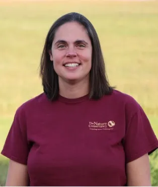 Melissa smiling confidently at camera.
