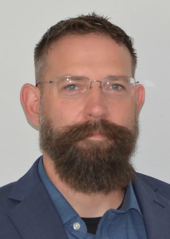 Jeremy looking confidently at camera. 