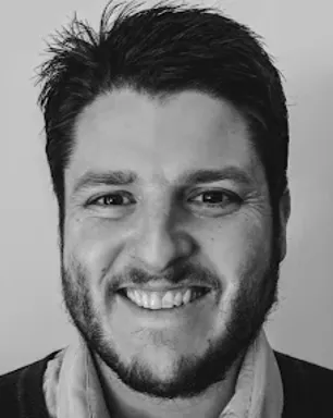 Mark Peterson smiling confidently at camera. 