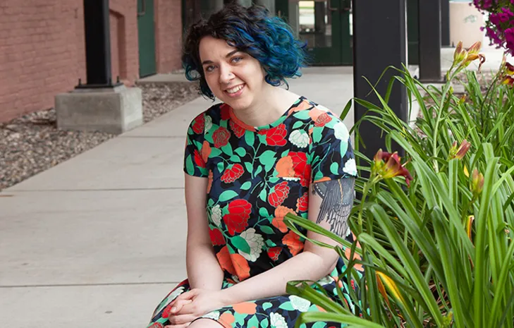 Bea Weberr smiling confidently at camera.