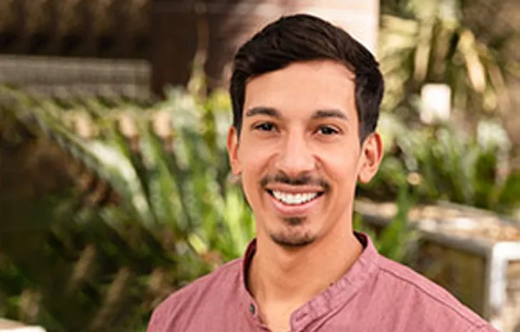 Carlos Montoya smiling confidently at camera.