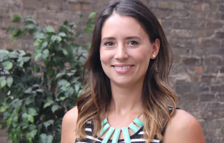 Emily Neuenschwander smiling confidently at camera.