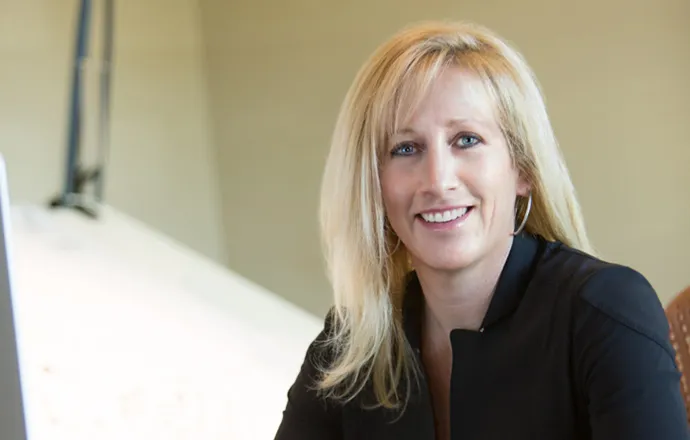 Kristi Hanson smiling confidently at the camera