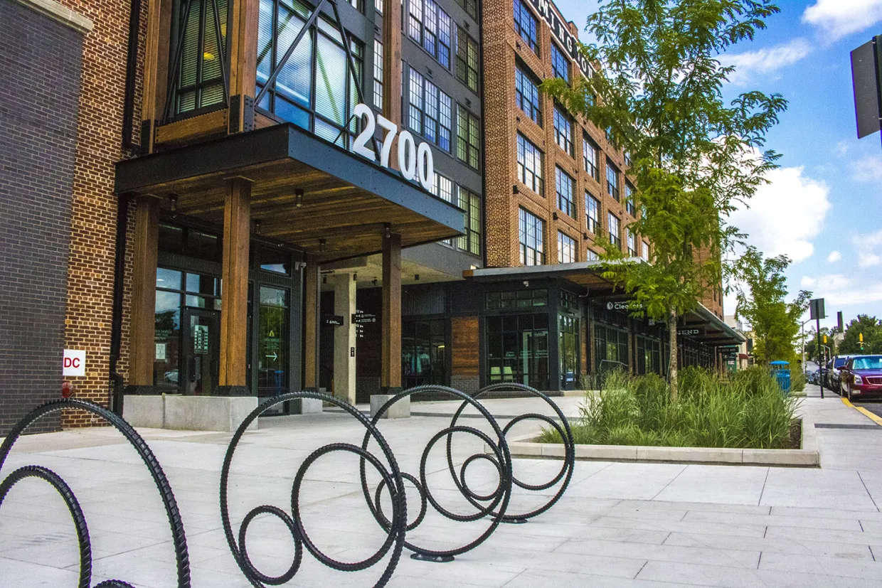 Bike racks on street in front of buidling.