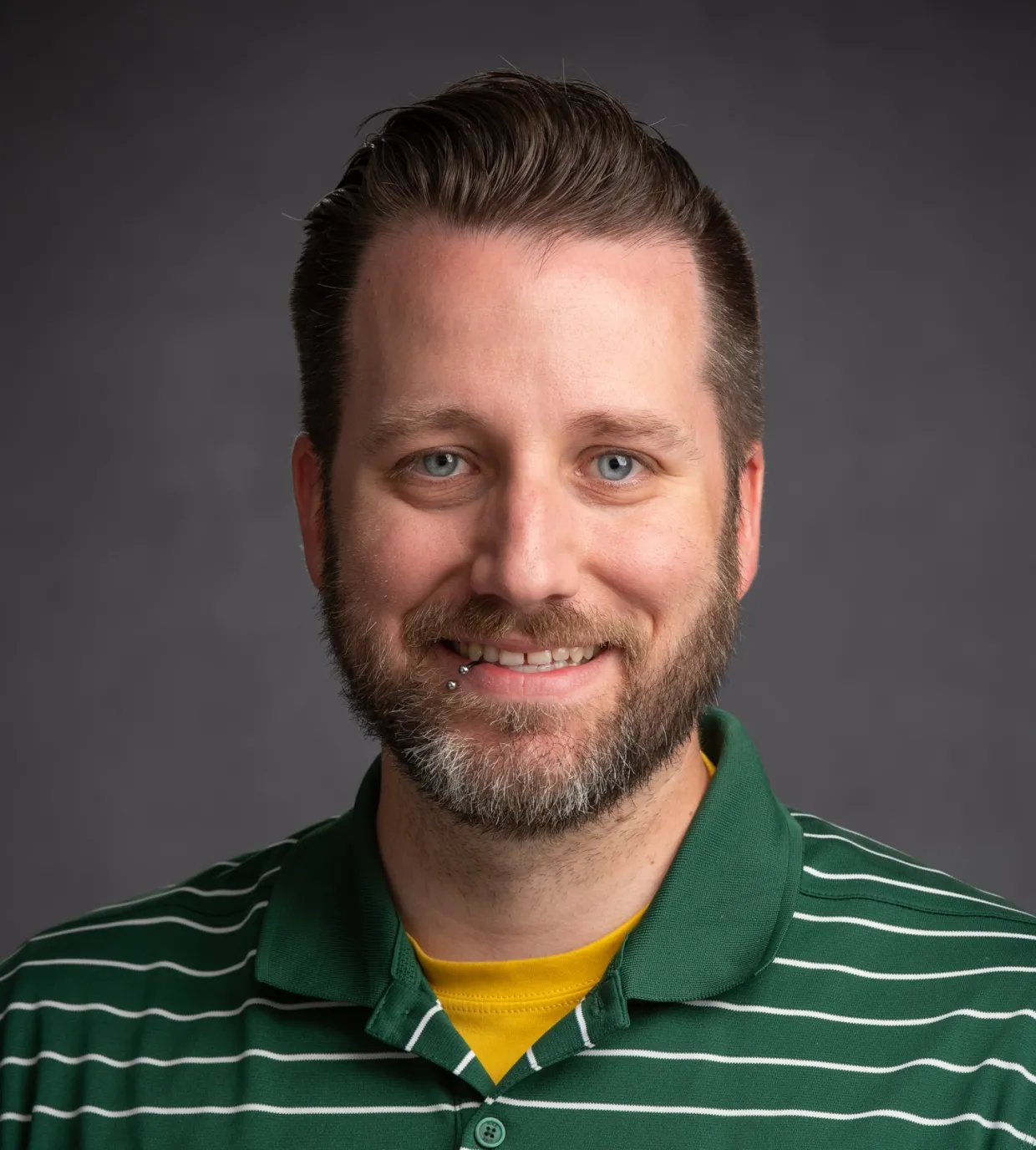 Travis Seaborn, PhD smiling confidently at camera.