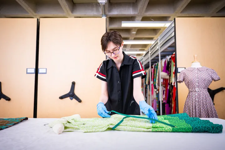 student works with historic costumes as part of Public History coursework