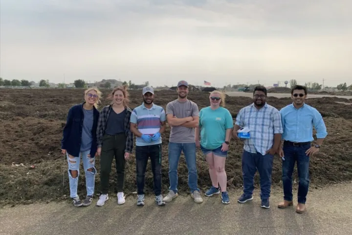 Syeed Iskander, NDSU assistant professor of civil, construction and environmental engineering, stands with a group of students.