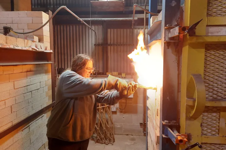 NDSU student using the new kiln at NDSU.