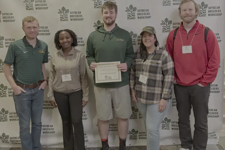 Award winner Sawyer Goodwin and four other teammembers smiling