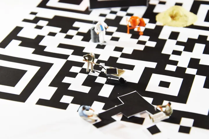 QR code with mini figures on it.  Abstract design