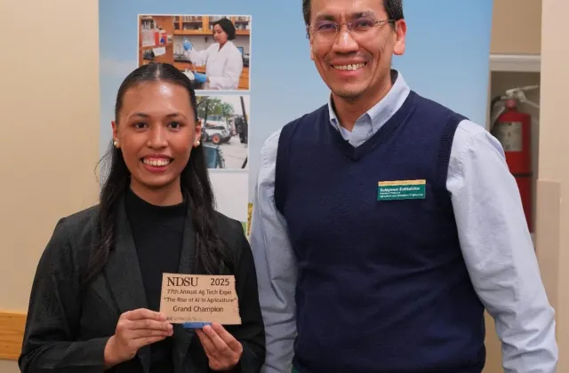 NDSU sophomore Joanna Daniella Fajardo and her award at the 77th annual Agricultural Technology Exposition