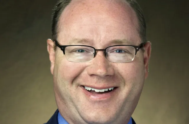 headshot of Travis Hoffman