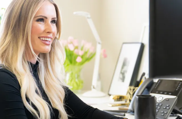 Alissa works on computer at desk