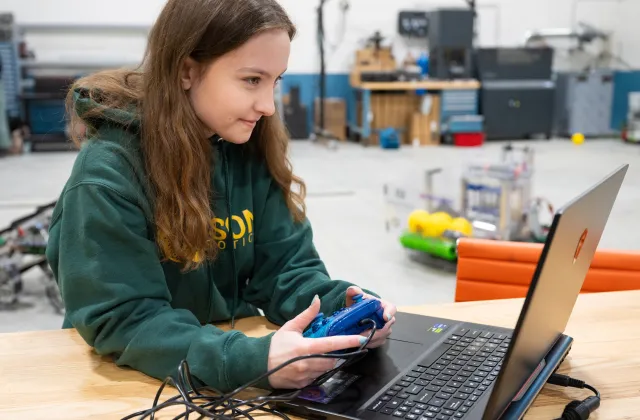NDSU Software Engineering student Kaitlyn Nickel works on a robotics project