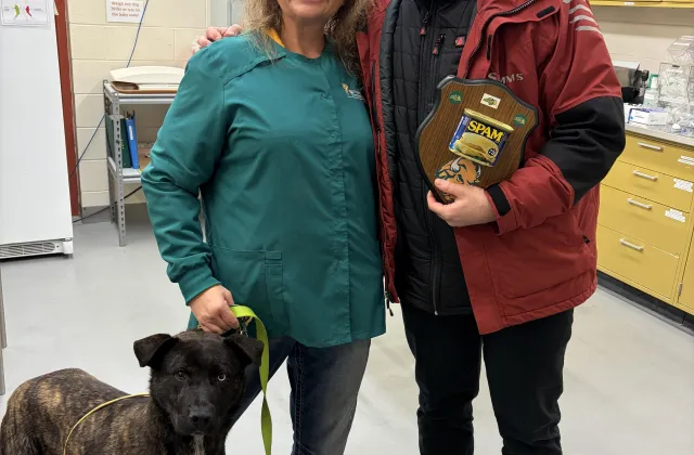 Stacey Ostby and Chris Byrd with SPAM award