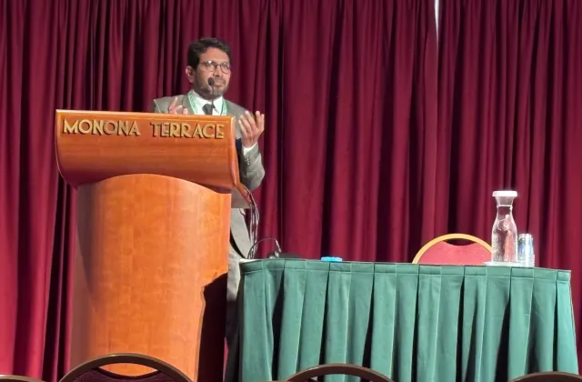 Grad student speaks at conference.