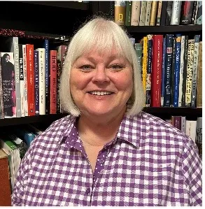 Susan Curtis smiling confidently at the camera