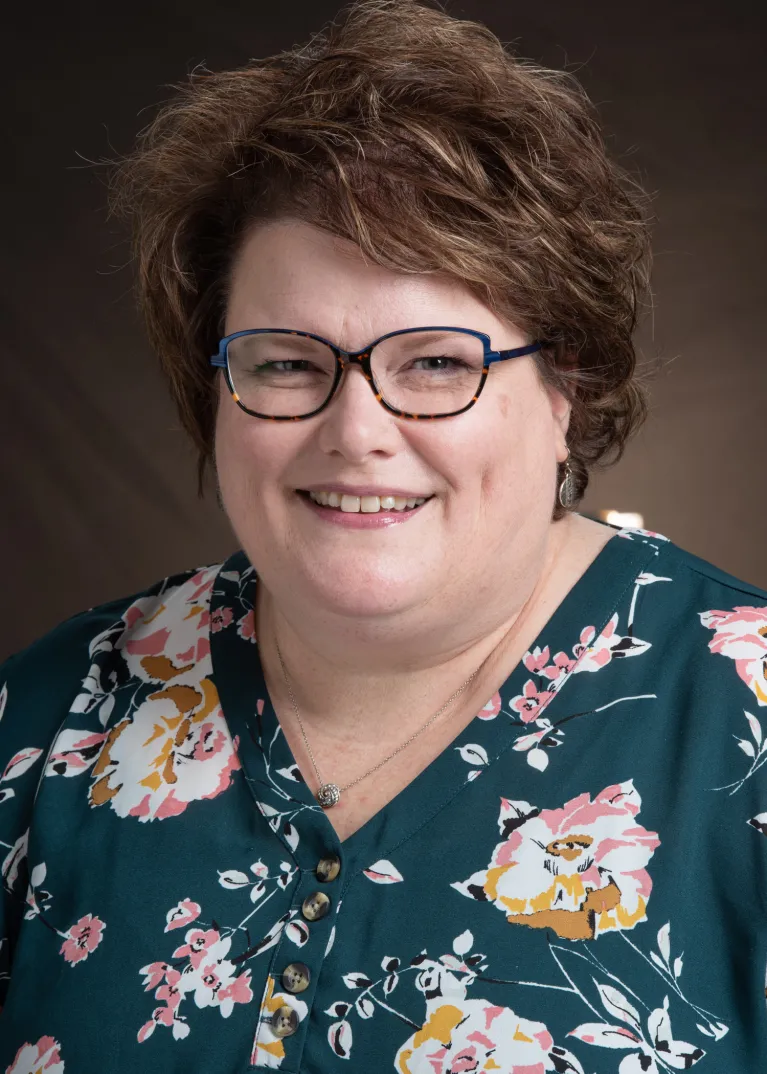 Sara Sunderlin smiling confidently at the camera