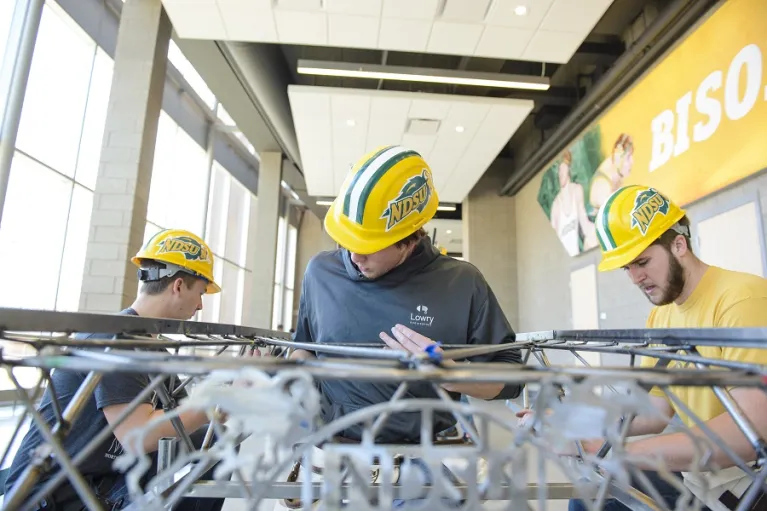 ASCE Steel Bridge students working on a project