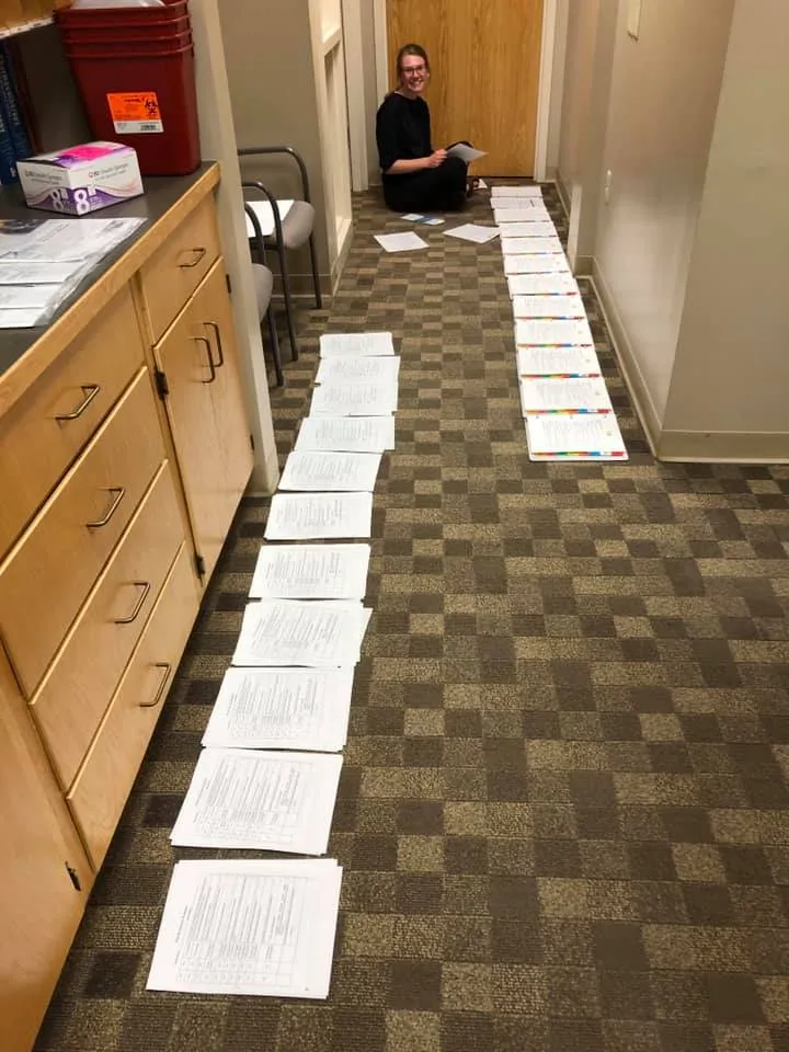 image of Anna making binders