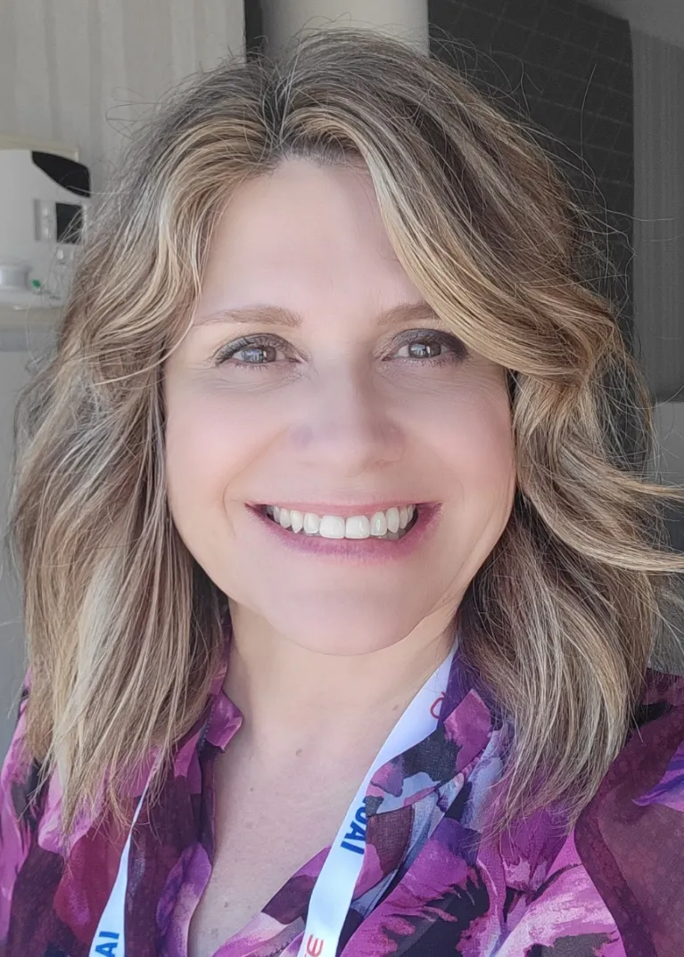 Archbold smiling confidently at camera.