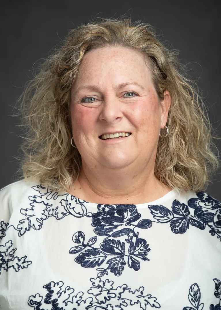 Connie Koski smiling confidently at camera