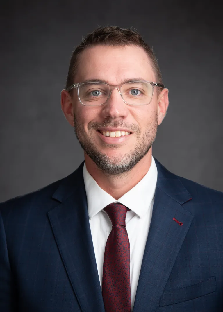 Meyer smiling confidently at camera.