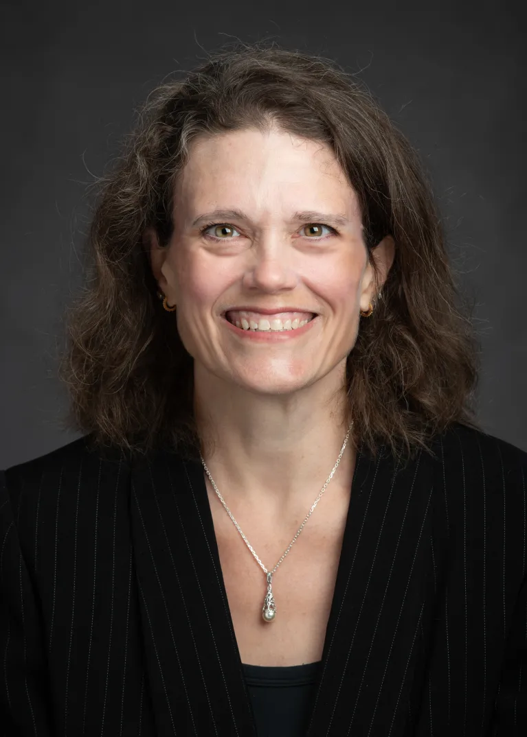 Stichman smiling confidently at camera