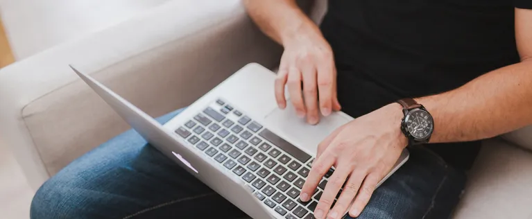 Man using computer to search for courses
