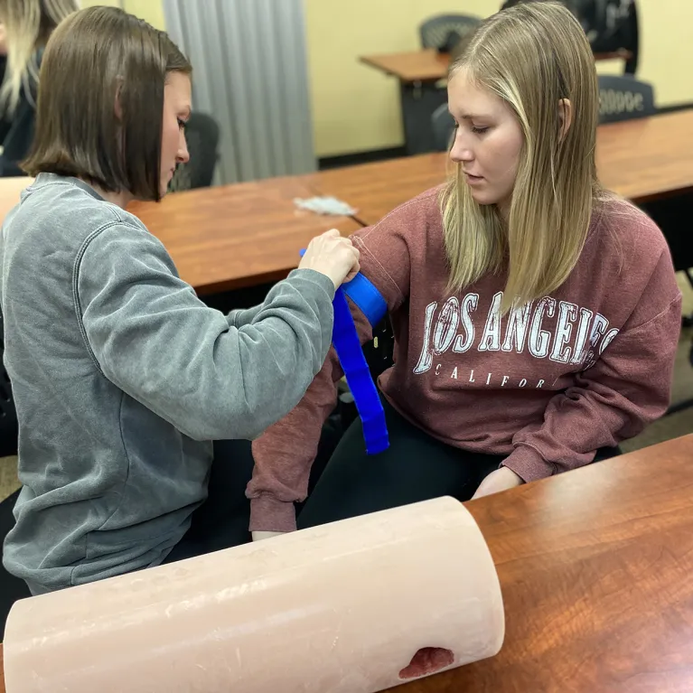 Image of students practicing stopping a bleed