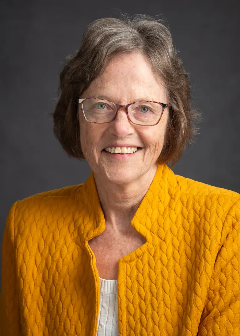 Kelly smiling at the camera