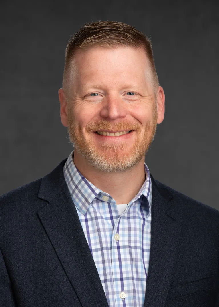 Dr. Briggs smiling confidently at camera.