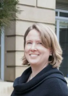 Dr. Carlson smiling confidently at camera.