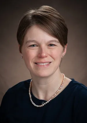 Dr. Nelson smiling confidently at camera.