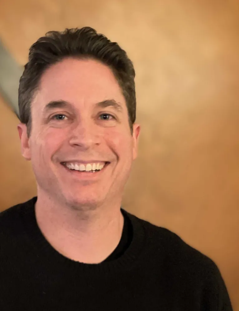 Dr. Pemstein smiling confidently at camera.